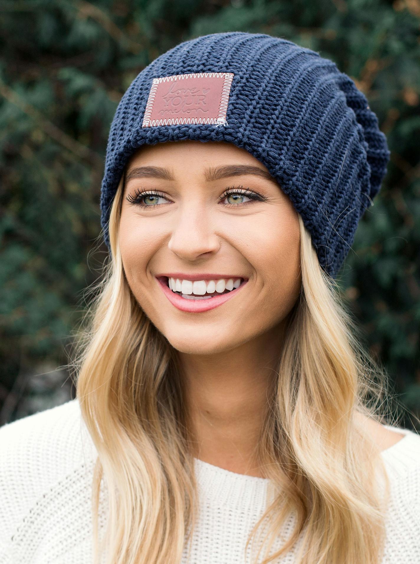 A model wears a Love Your Melon beanie.