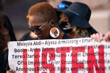 Angela Williams at a news conference held by current and former Minneapolis city employees outside City Hall before the City Council meeting Thursday.