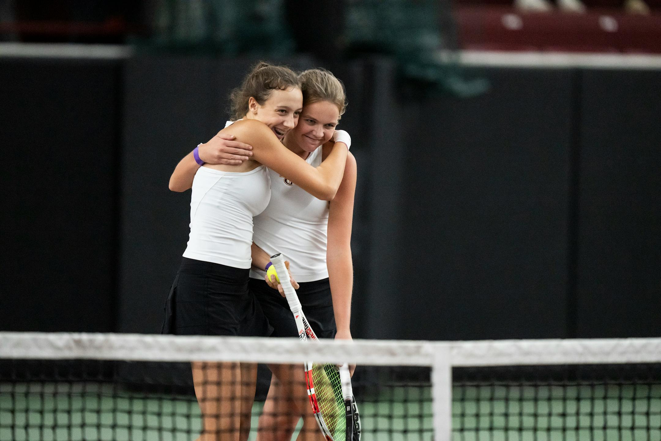 Maple Grove's first doubles players Lexi Helmer-Jahnke and Amelia Larsen celebrate winning against Elk River during the Class 2A team girls tennis quarterfinals.