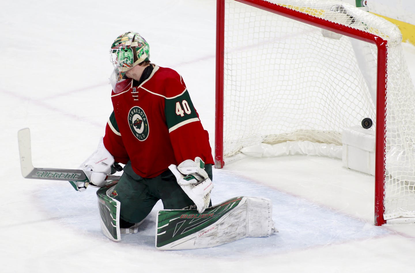 Minnesota Wild goalie Devan Dubnyk (40) tuns to see the go-ahead goal in the net during the third period of an NHL hockey game against the Colorado Avalanche, Saturday, Nov. 19, 2016, in St. Paul, Minn. Colorado won 3-2. (AP Photo/Paul Battaglia)