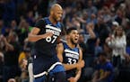 Timberwolves center Karl-Anthony Towns, right, and Taj Gibson