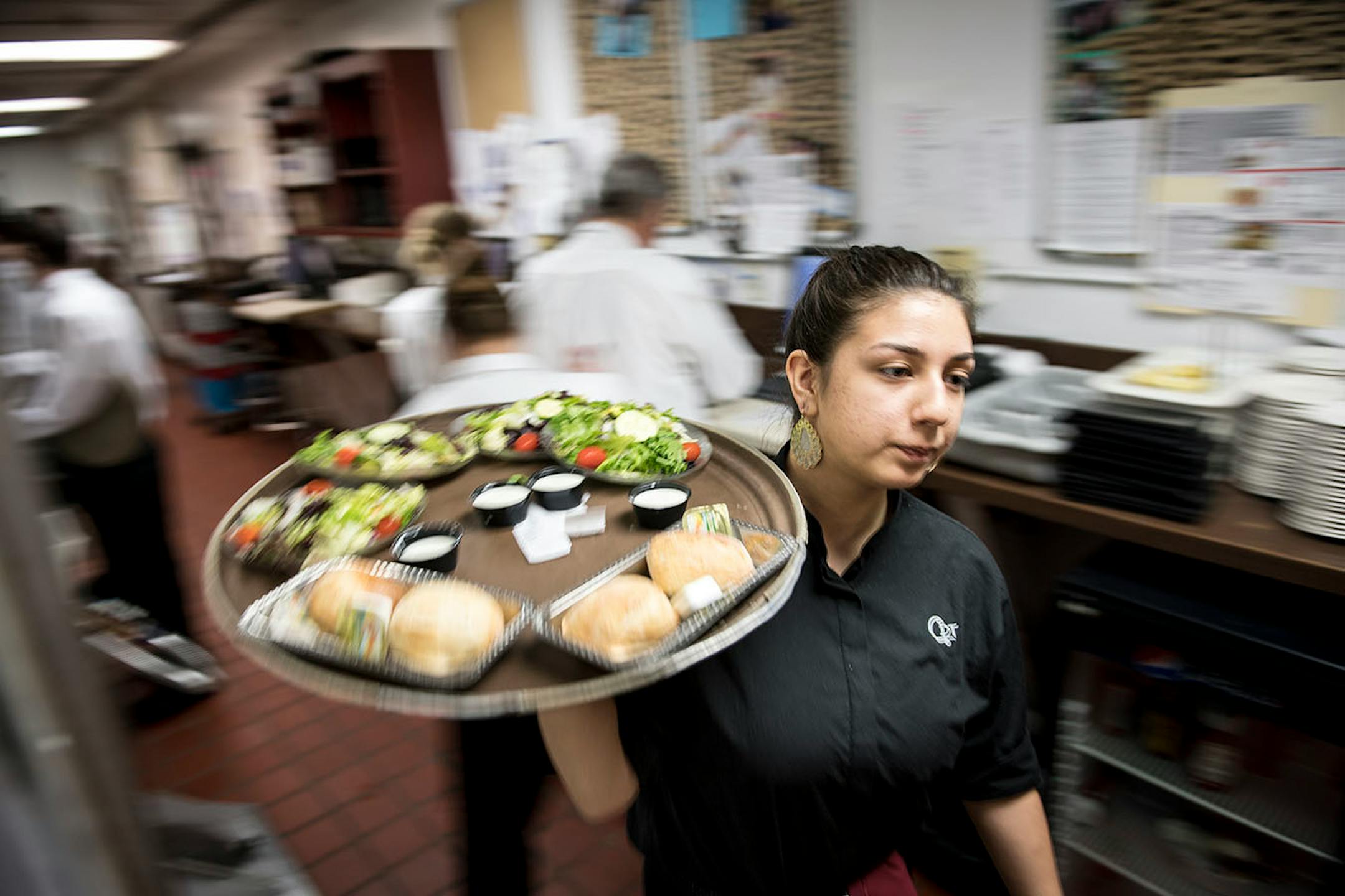 Samantha Navarro, of Shakopee, has worked at Chanhassen Dinner Theatres for 3-weeks as a server assistant. She brought bread and salads to diners before a showing of Beauty and the Beast.