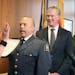 New St. Paul Police Chief Todd Axtell stood before Mayor Chris Coleman's as he was officially sworn in as police chief, Thursday, June 23, 2016 in St.