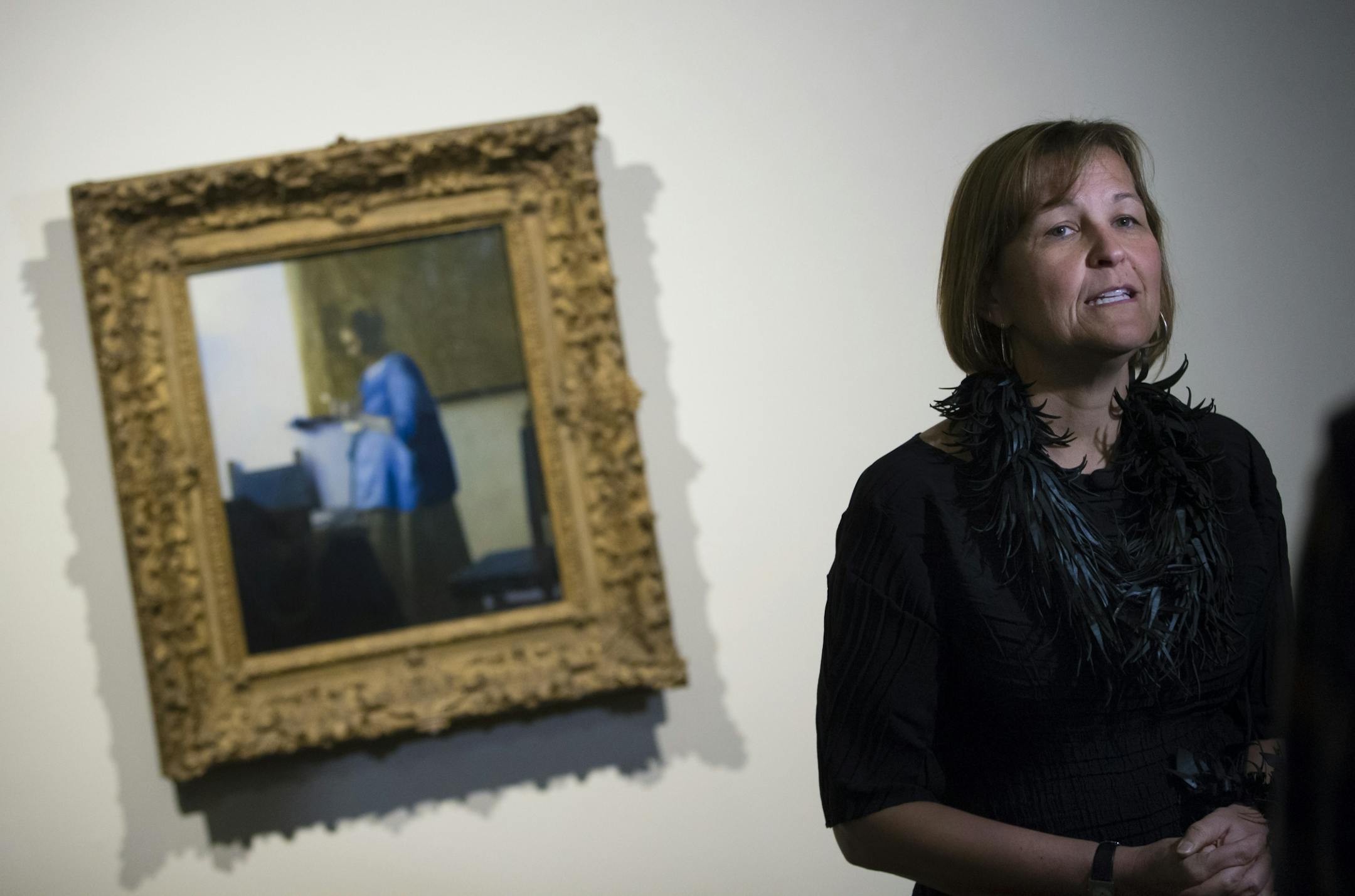 MIA Museum director Kaywin Feldman talked about the painting by Johannes Vermeer Woman in Blue Reading Letter at the staff unveiling of the Minneapolis Institute of Arts' first big "surprise" of its centennial year on Friday, January 16, 2015, in Mineapolis, Minn.