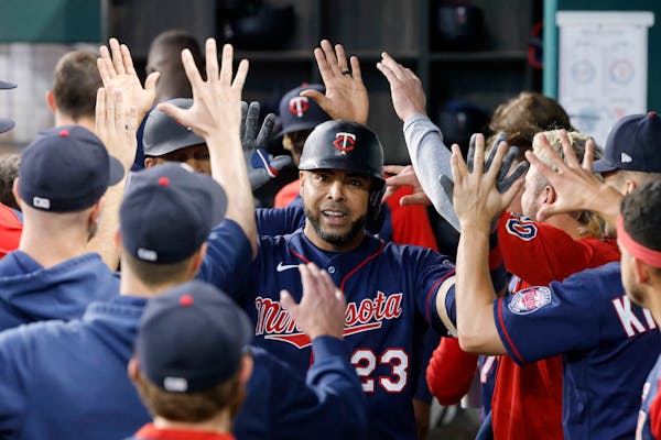 Nelson Cruz celebrates his two-run home run against the Rangers during the fourth inning