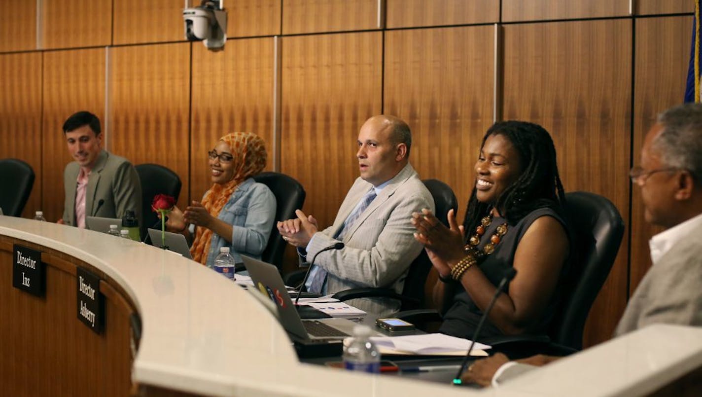 Minneapolis school board members, from left, Josh Reimnitz, student rep Shaadia Munye, Nelson Inz, Tracome Asberry and Don Samuels reacted after the board picked Ed Graff as the new superintendent Tuesday.