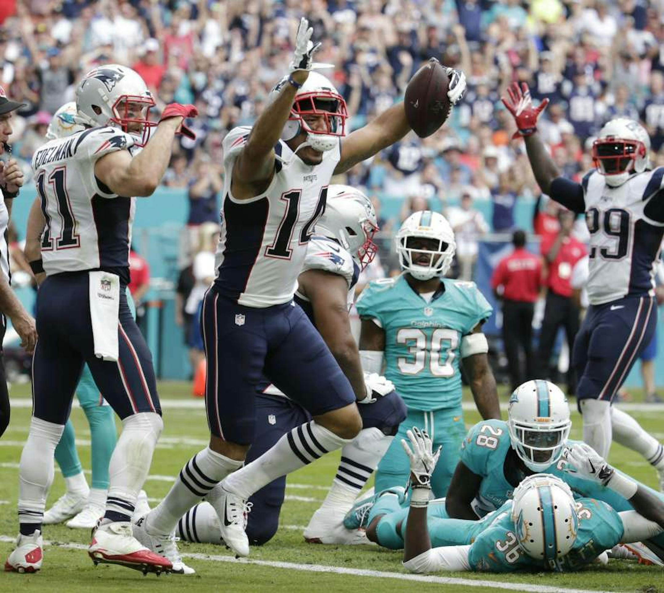 Patriots wide receiver Michael Floyd celebrates his touchdown against the Dolphins on Jan. 1.