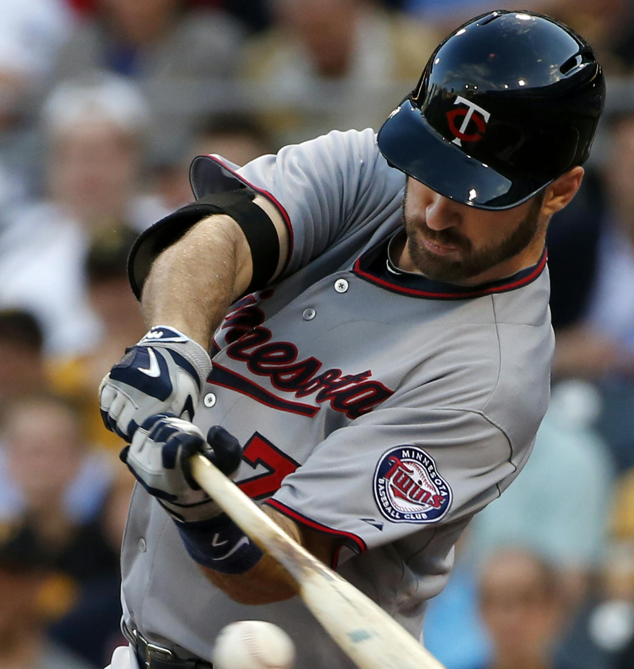 Minnesota Twins' Joe Mauer drives in three runs with a double off Pittsburgh Pirates starting pitcher Francisco Liriano during the second inning of a baseball game in Pittsburgh on Tuesday, May 19, 2015.(AP Photo/Gene J. Puskar)