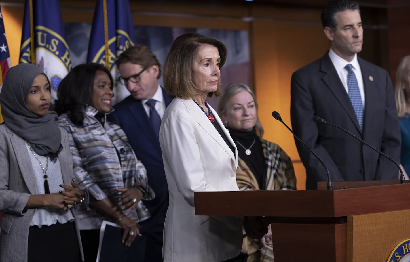 U.S. Rep. Ilhan Omar, far left, and U.S. Rep. Dean Phillips, third from left, participate in a press conference of House Democrats in November 2018. (AP Photo/J. Scott Applewhite)