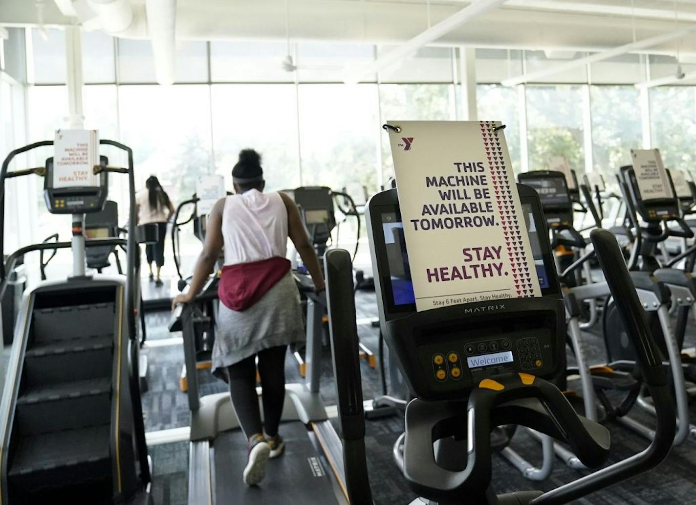 The Midway YMCA was one of two of the first YMCAs to reopen June 10 at 25% capacity. Here, every other treadmill and other workout machine is available to help with social distancing and in order to rotate deep cleaning of the machines Friday at the YMCA in St. Paul.