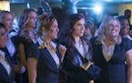 This image released by Universal Pictures shows, from left, Chrissie Fit, Anna Camp, Alexis Knapp, Brittany Snow, Anna Kendrick, Rebel Wilson and Este