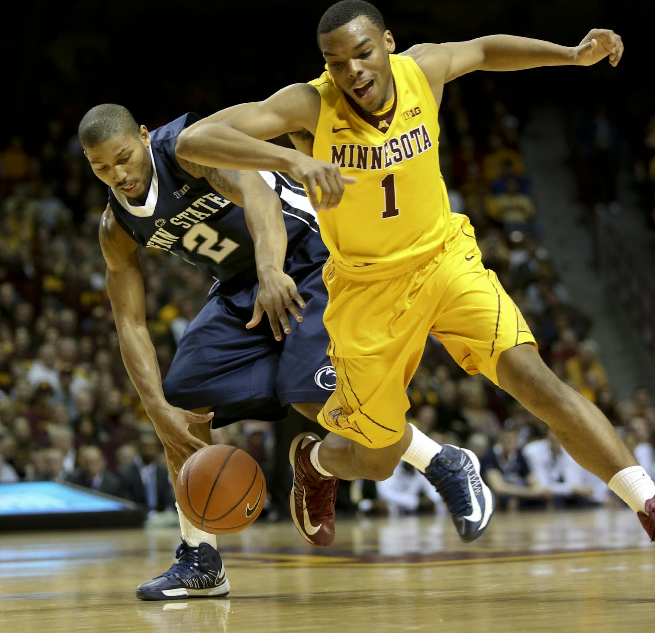 Gopher's Andre Hollins and Penn State's D. J. Newbill fought for possession of the ball in the second half at Williams Arena in Minneapolis, Min., Saturday, March 2, 2013. Gophers won 73-44.