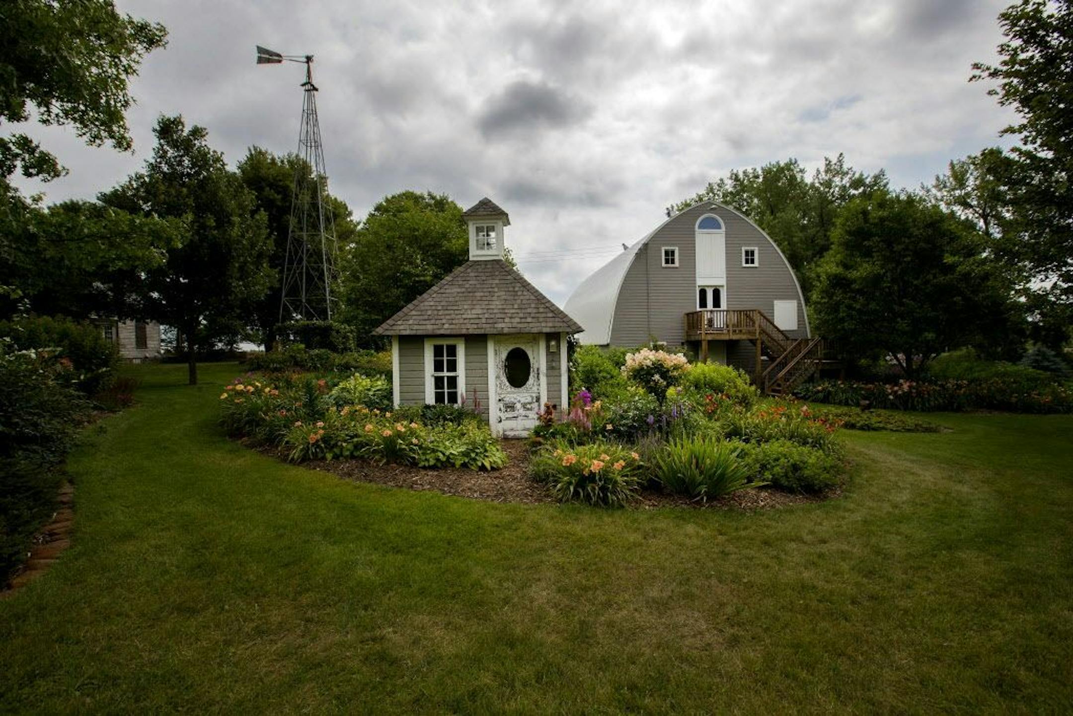 The Youngs fixed up an old smokehouse and surrounded it with beds of peonies and daylilies.