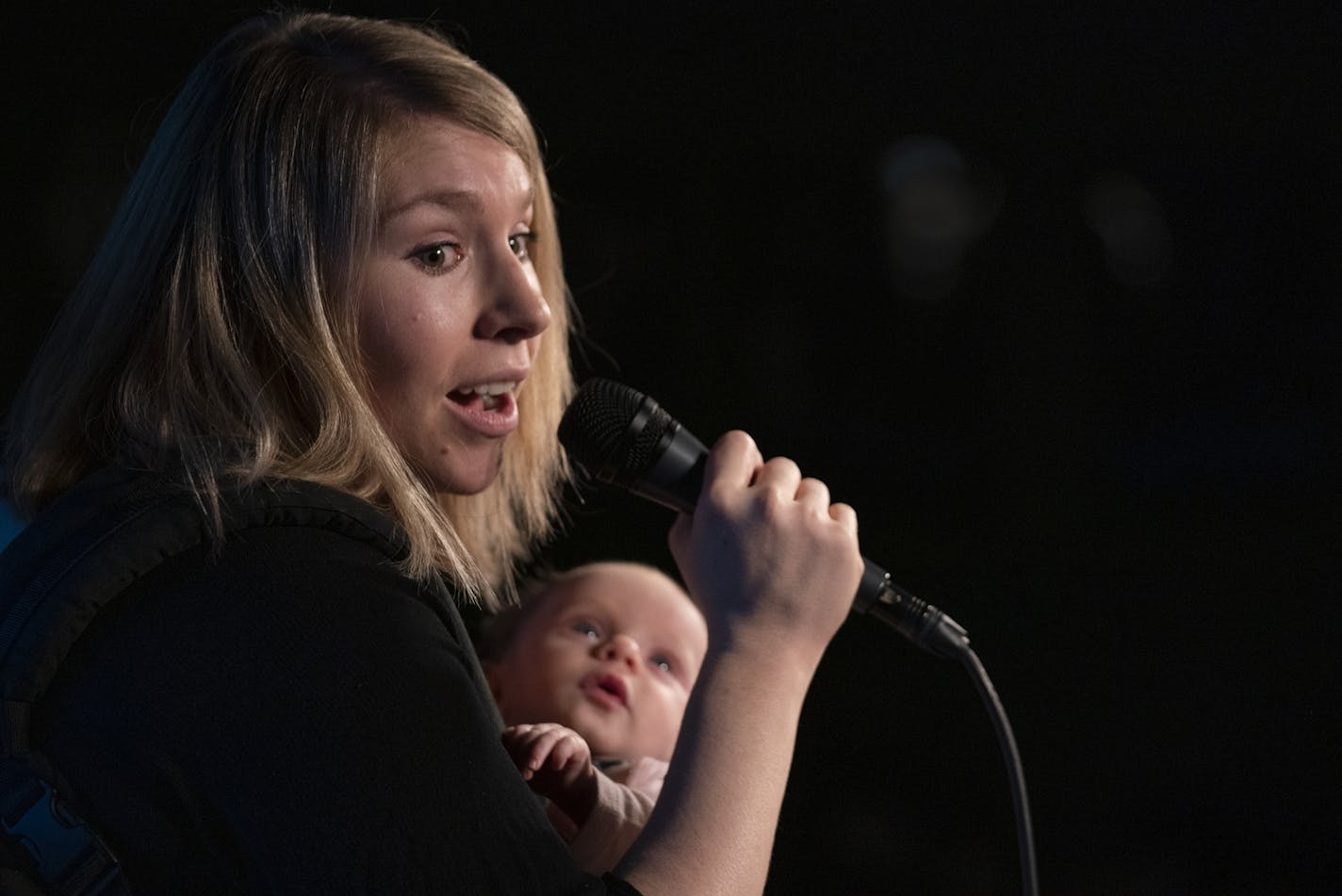 Comic Marial Elizabeth during her set at the "Day Drinking with Mom" showcase with her infant daughter, Autumn, in a front pack. It was her first performance since having her third child and was also Autumn's stage debut. ] JEFF WHEELER &#x2022; jeff.wheeler@startribune.com "Day Drinking with Mom" is a monthly showcase for female comics hosted by Wendy Maybury and Karen Pickering at House of Comedy at the Mall of America. The show was photographed Tuesday night, March 20, 2019 at the MOA in Bloo