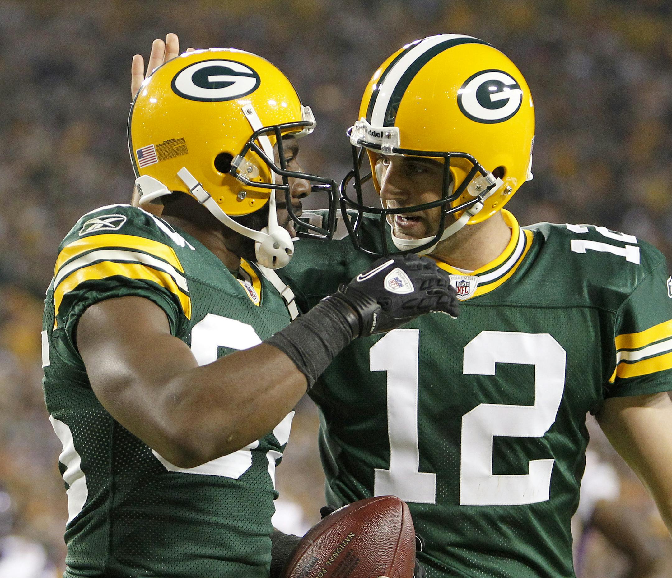 CARLOS GONZALEZ • cgonzalez@startribune.com  October 24, 2010 – Green Bay, Wisconsin - Lambeau Field – NFL – Minnesota Vikings vs. Green Bay Packers ] Greg Jennings (85) and Aaron Rodgers (12) celebrated their touchdown in the third quarter. Green Bay beat Minnesota by a final score of 28-24. ORG XMIT: MIN2013102318244174