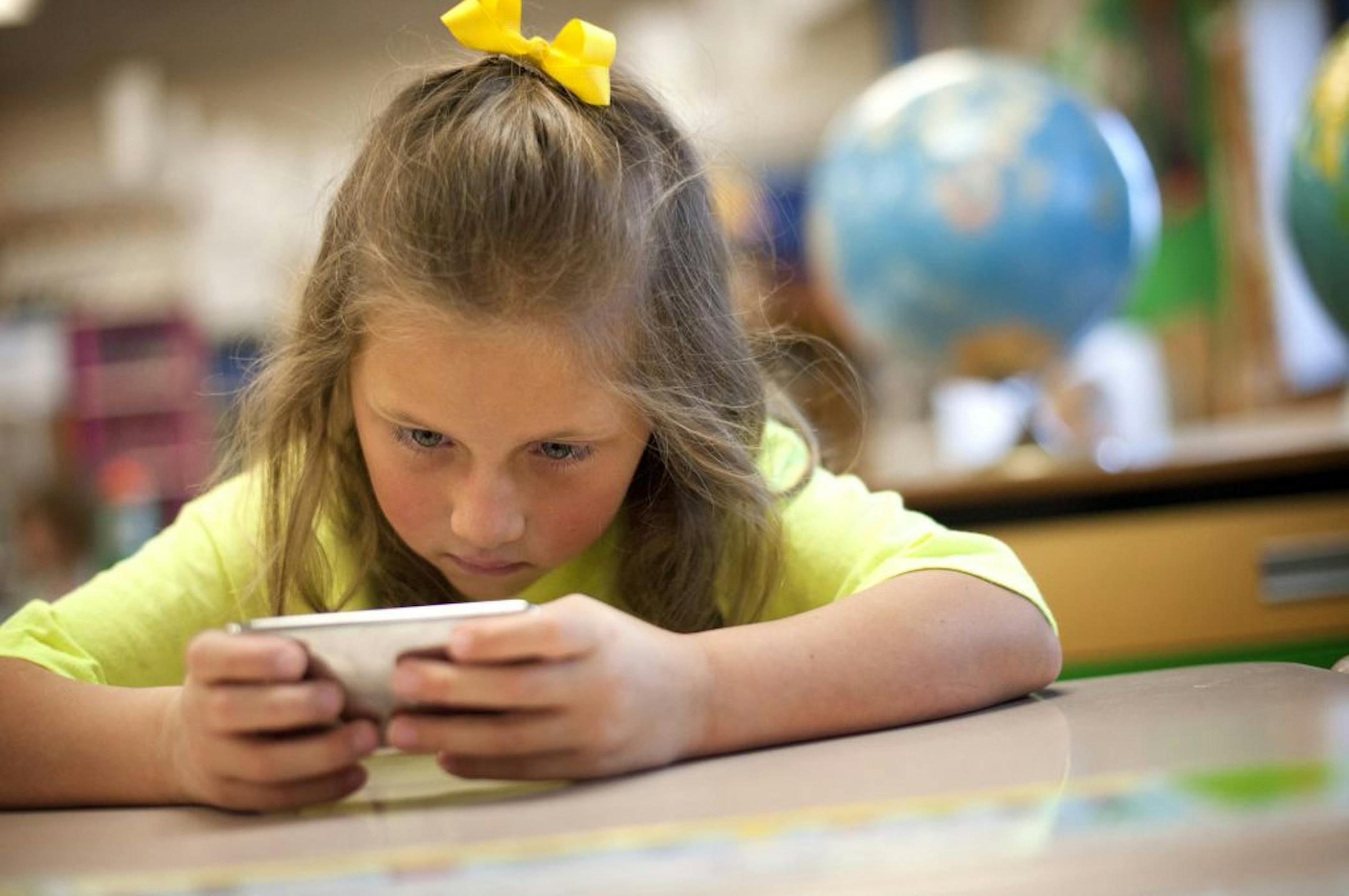First grader Morgan Keller worked on her addition and subtraction skills with Math Bumpies on an ipod Touch at Johnsville Elementary School in Blaine. Her teacher Ben Dwyer won a TIES award for integrating technology into the classroom and was able to get 6 of the ipods which have much faster processors than the 11-year-old iMacs also in use in the classroom. Thursday, October 27, 2011.A technology levy will go before the voters this fall in the Anoka-Hennepin district.