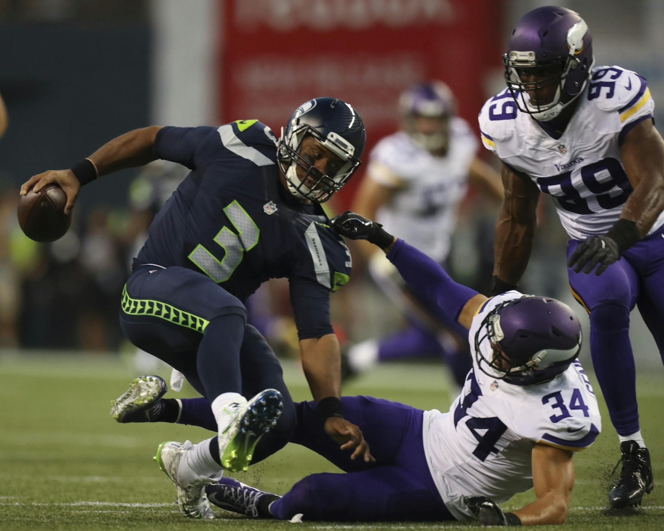 Vikings strong safety Andrew Sendejo (34) sacked Seattle Seahawks quarterback Russell Wilson for an 18 yard loss in the second quarter Thursday night.