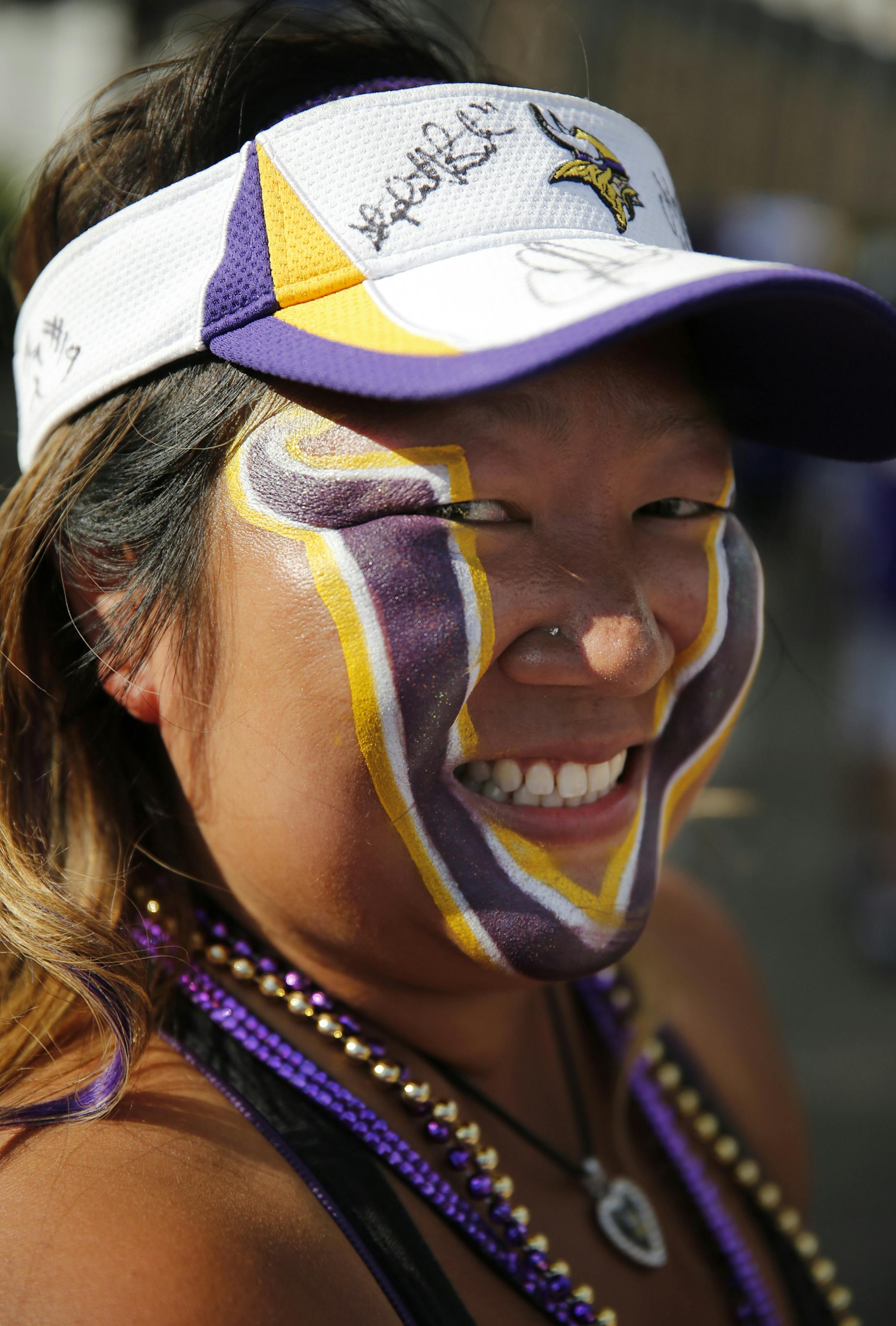 At a tailgating parking lot near the Metrodome before the first preseason game between the Vikings and the Texans, Erin Darsow of Burnsville had her game face on. ] tsong-taataarii@startribune.com