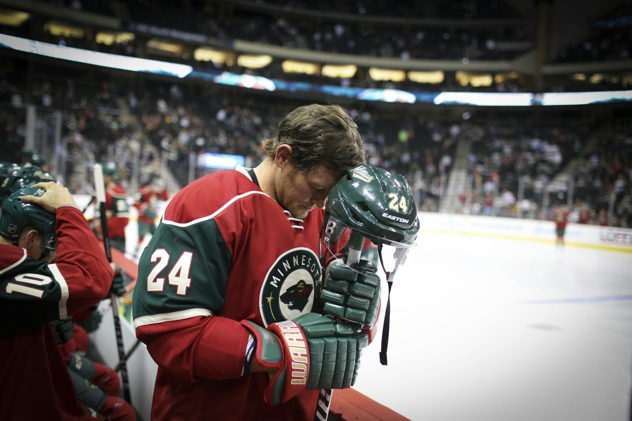 Wild left wing Matt Cooke bowed his head at the beginning of the Minnesota Wild vs. the Pittsburgh Penguins pre-season NHL game at the Xcel Energy Center on Monday, September 29, 2014 in St. Paul, Minn.