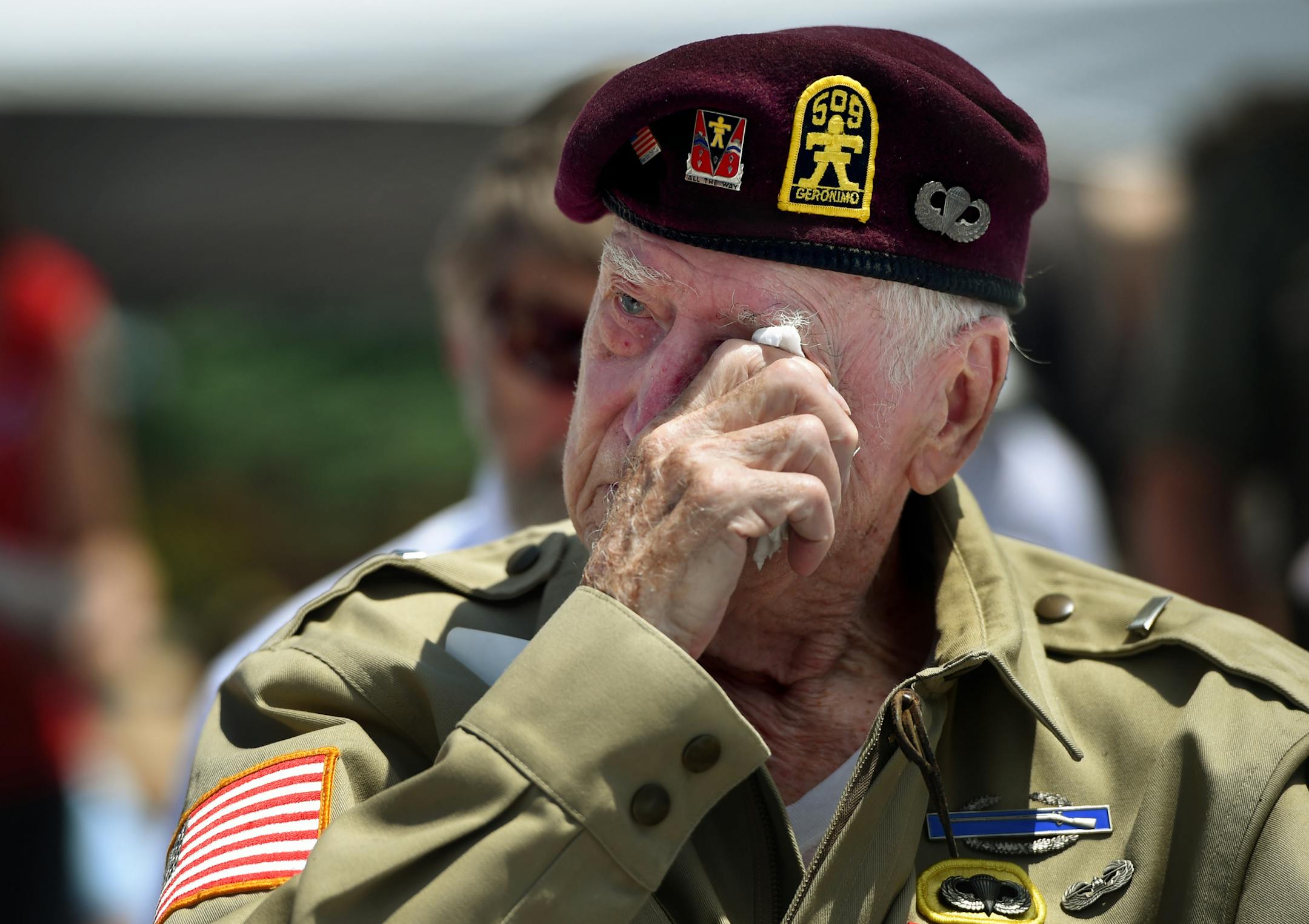 D-day veteran John Kessler tears up during the playing of "Amazing Grace" during the 70th anniversary observance of D-Day, on Friday, June 6, 2014, at the National D-Day Memorial in Bedford, Va. (AP Photo/The News & Advance, Jill Nance)