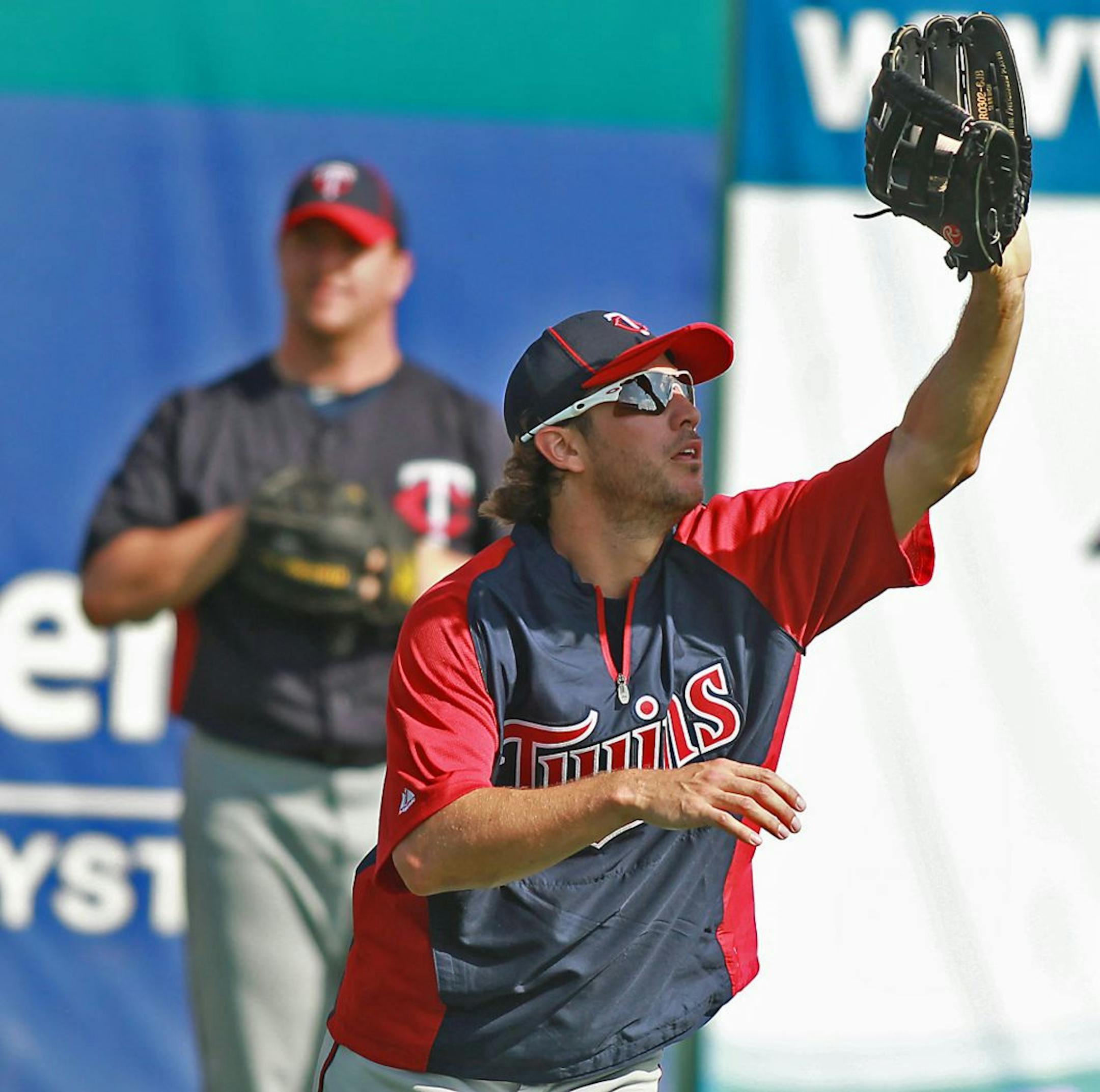 The Minnesota Twins Trevor Plouffe made a grab from the outfield during the team's Spring training workout, Tuesday, February 28, 2012. (ELIZABETH FLORES/STAR TRIBUNE) ELIZABETH FLORES � eflores@startribune.com