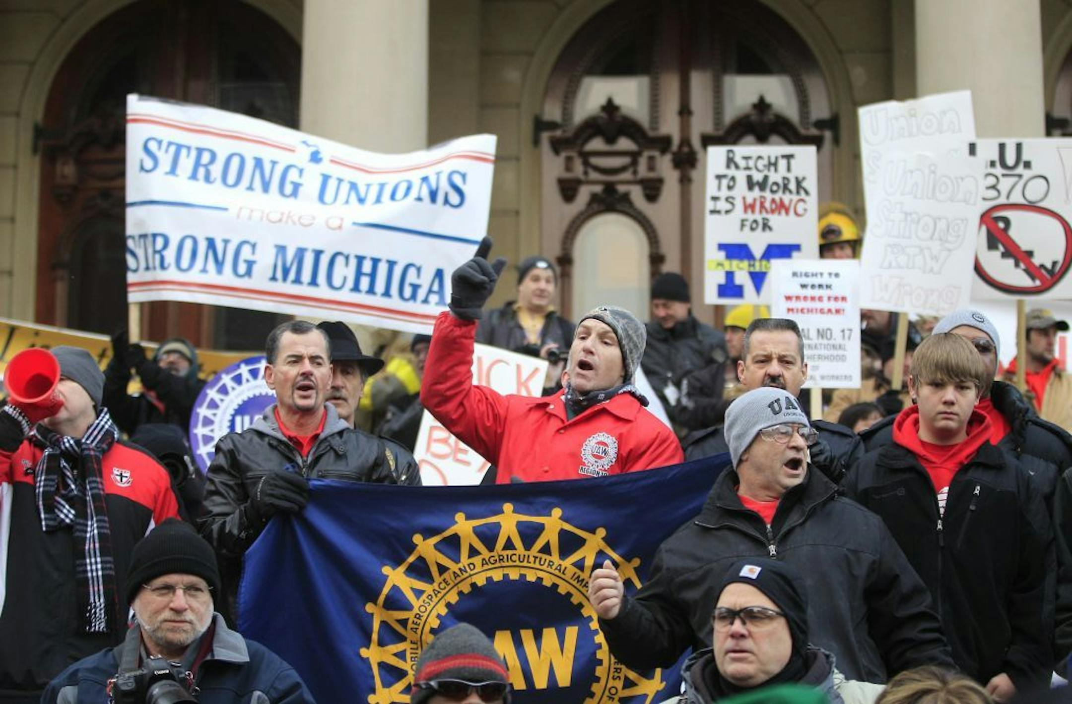 Thousands of protesters gather for a rally on the State Capitol grounds in Lansing, Mich., Tuesday, Dec. 11, 2012. The crowd is protesting right-to-work legislation that was passed by the state legislature last week.