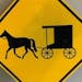 Signs such as this one warns alerts motorists to slow-moving Amish buggies travel in the area.