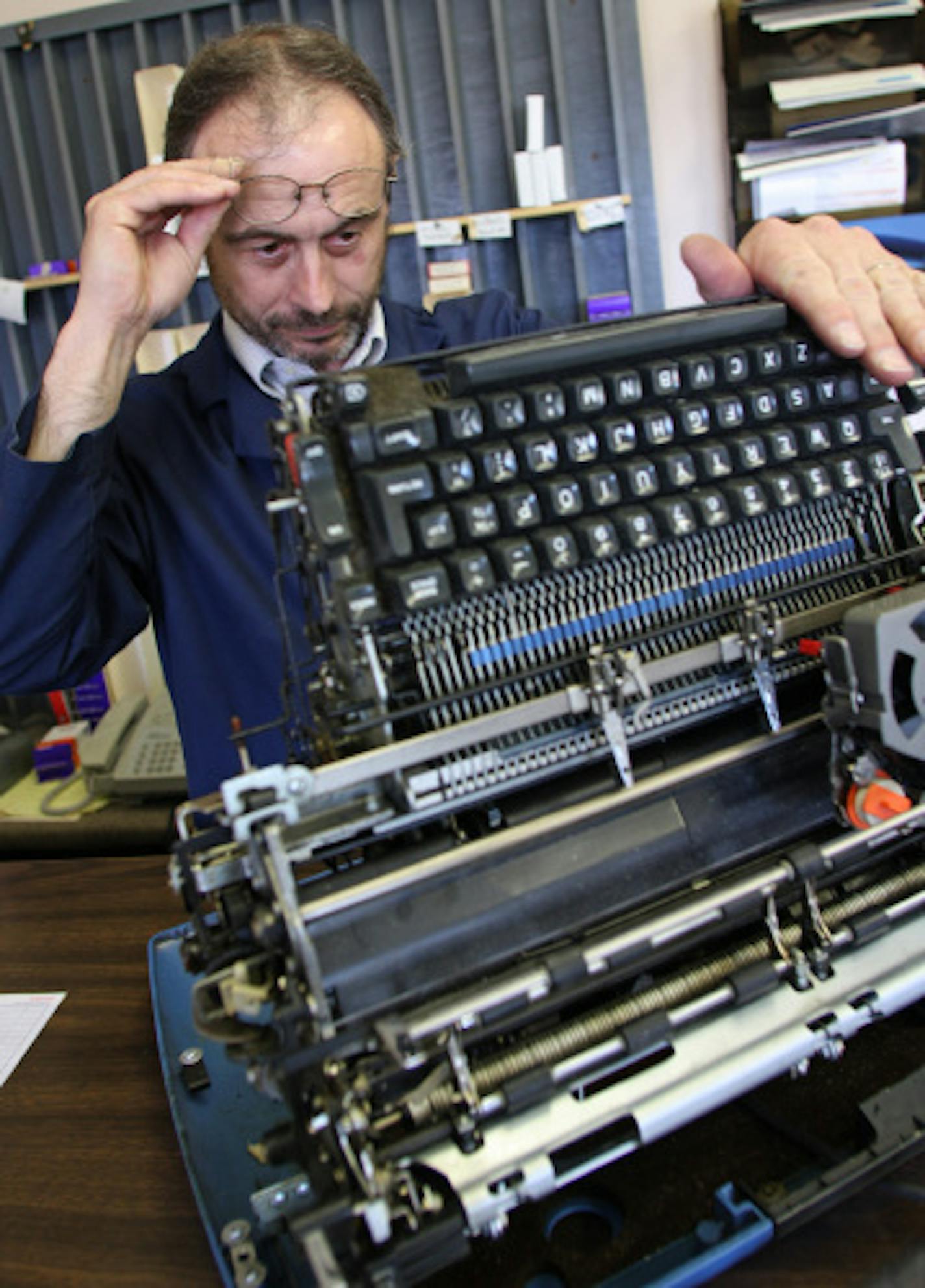 Mark Soderbeck examined an IBM Selectric II that had been brought in for cleaning.