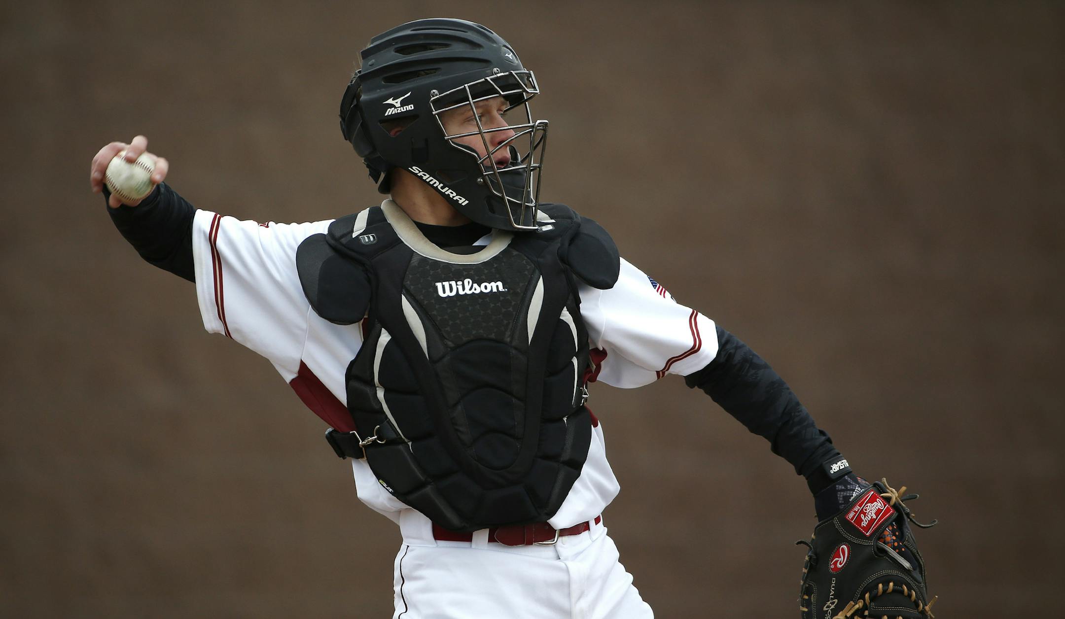 Lakeville's catcher Kelby Johnson threw the ball back to the pitcher during their game against Rosemount. ] (KYNDELL HARKNESS/STAR TRIBUNE) kyndell.harkness@startribune.com Lakeville South vs Rosemount in Lakeville Min., Wednesday, April 8, 2014.