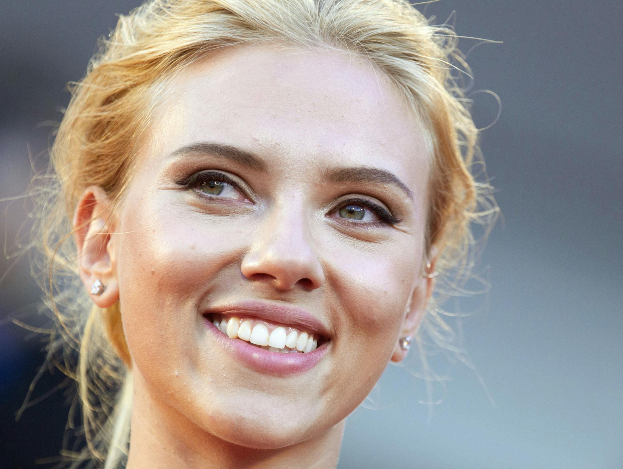 FILE - In this Sept. 3, 2013 file photo, actress Scarlett Johansson poses for photographers on the red carpet for the screening of the film "Under The Skin" at the 70th edition of the Venice Film Festival in Venice, Italy. Johansson is ending her relationship with Oxfam International after being criticized over her support for an Israeli company that operates in the West Bank. (AP Photo/Andrew Medichini, File)