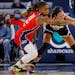 Mystics guard Shavonte Zellous (21) tried to pry the ball away from Lynx forward Napheesa Collier on Saturday at Target Center.