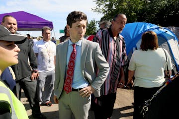 Minneapolis Mayor Jacob Frey visited a homeless encampment near the LIttle Earth housing project in 2018. Protesters who are angry about what they cal