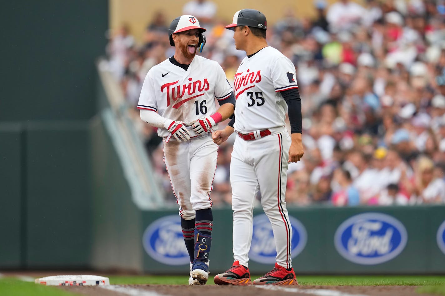 Minnesota Twins' Jordan Luplow (16) celebrates after reaching on an infield single during the sixth inning of a baseball game against the New York Mets, Saturday, Sept. 9, 2023, in Minneapolis. (AP Photo/Abbie Parr)