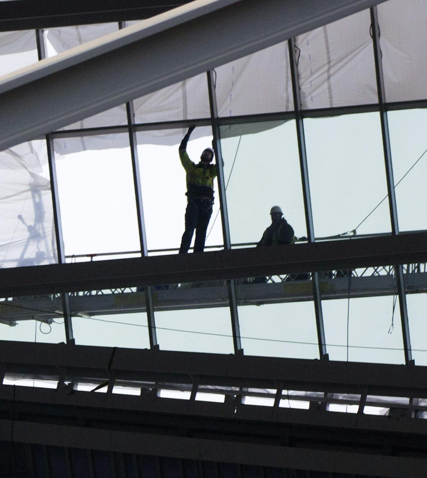 ] Three layers of tough plastic and two air pillows stretched over the steel roof of the new Minnesota Vikings stadium will keep the building from collapsing under the heavy snow this winter. Unlike the Metrodome's roof, which notoriosly collapsed under heavy snow, the new stadium has steel supports and cables to reinforce the plastic if the snow gets heavy. The material, which is similar to Teflon, both sheds water and shields the sun.Engineers say the material has been tested in hurricane-cond