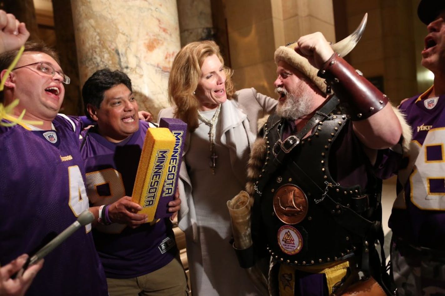 Sen. Julie Rosen, the author of the stadium bill, celebrated the passage of the bill with a few Vikings fans outside the Senate chambers late Tuesday night, May 8, 2012 at the Capitol in St. Paul, Minn.