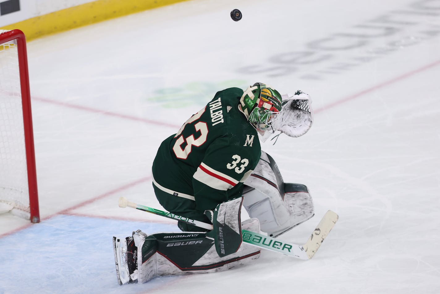 Minnesota Wild goaltender Cam Talbot (33) blocks the puck during the third period of an NHL hockey game against the Colorado Avalanche, Sunday, March 27, 2022, in St. Paul, Minn. Minnesota won 3-2 in overtime. (AP Photo/Stacy Bengs)