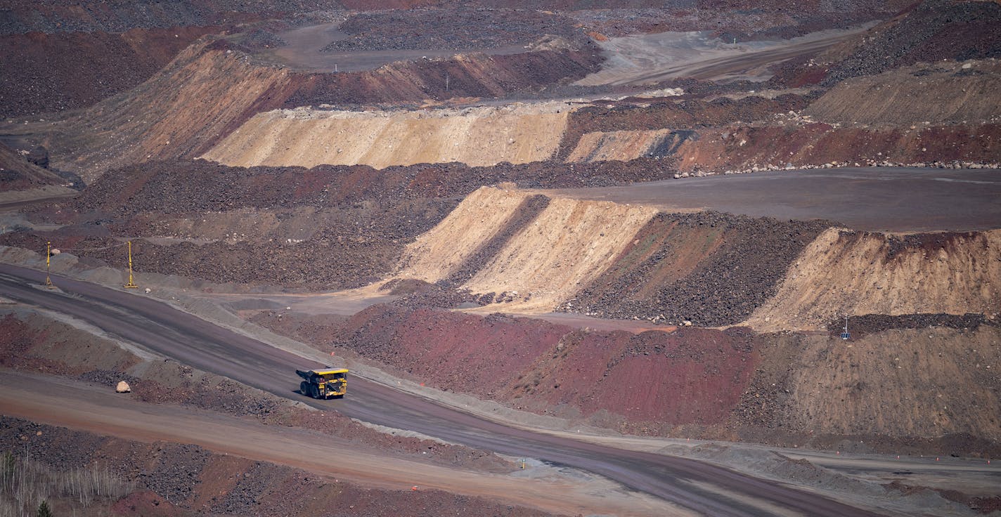 Trucks at the Hull Rust taconite mine transported some of its final loads of ore to be processed before it is temporarily idled on Sunday.