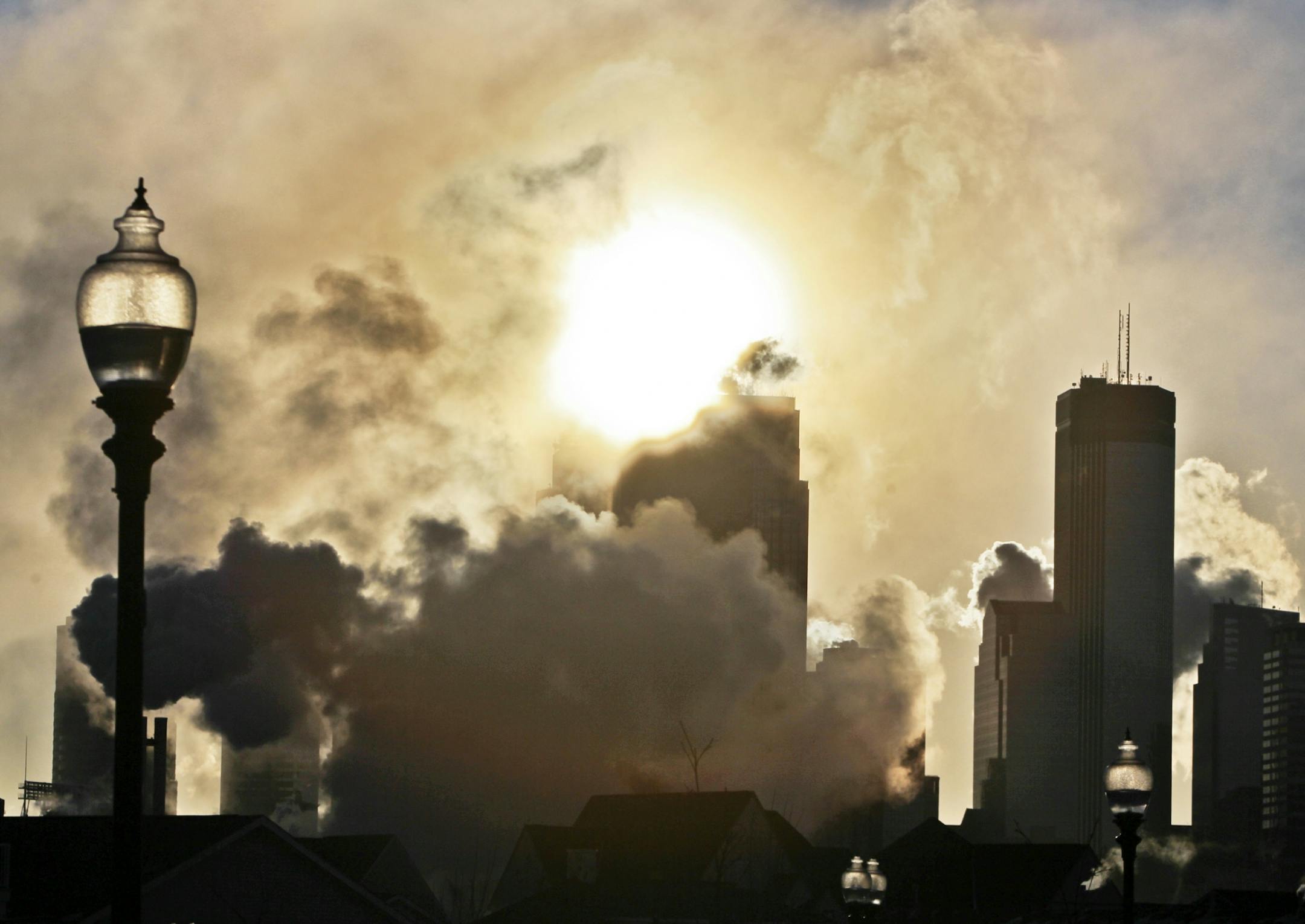 Minneapolis' skyline appears locked in winter's cold grip as temps dropped below minus 10 Thursday, Jan. 19, 2012 in Minneapolis, MN.