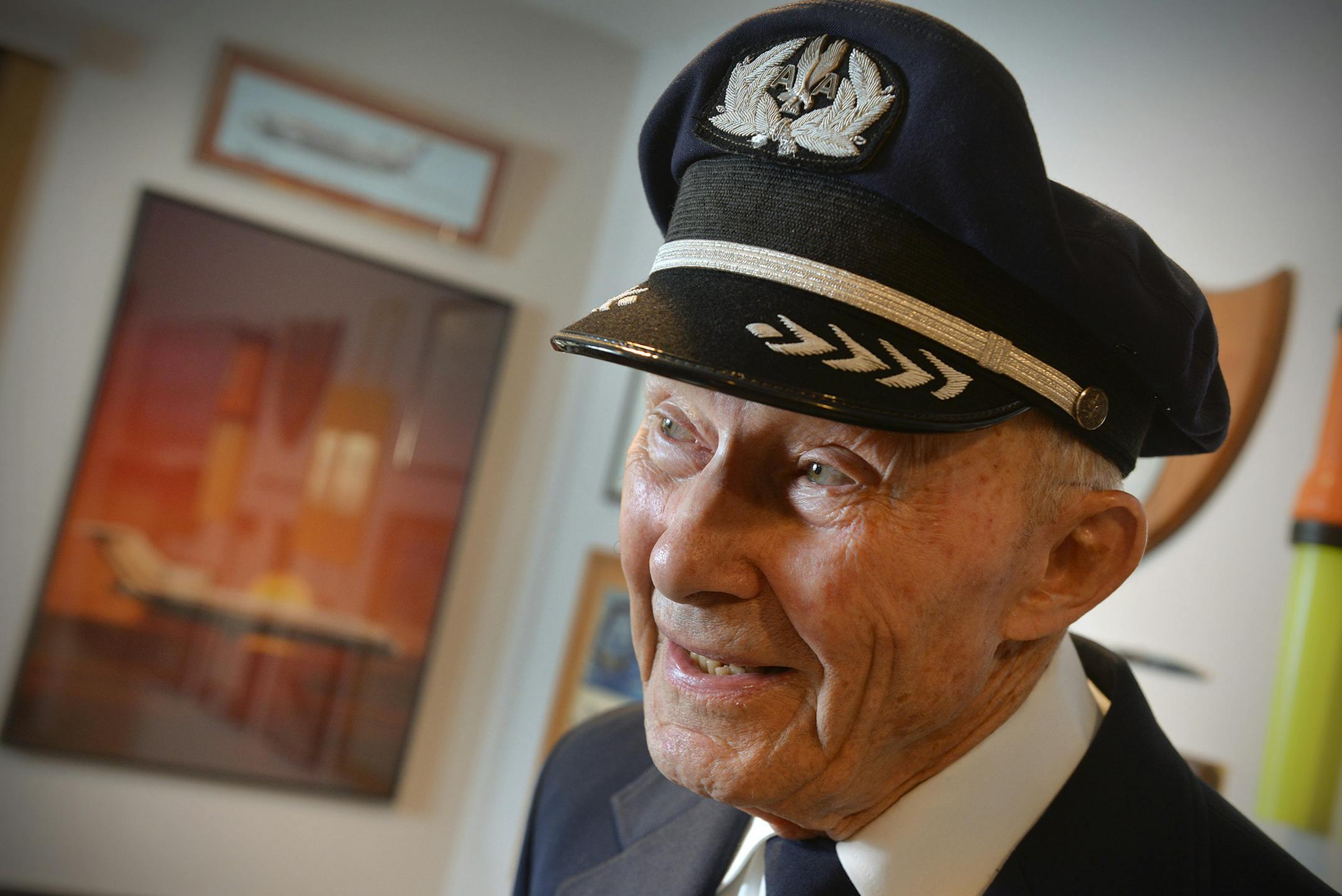 Retired American Airlines pilot Andy Anderson talks Wednesday, April 6, 2016, in his St. Cloud, Minn., home about the experience of being there in full uniform to pin wings on his granddaughter, Katie, as she became a flight attendant. The uniform still fits Anderson, now 85. (Kimm Anderson/St. Cloud Times via AP)