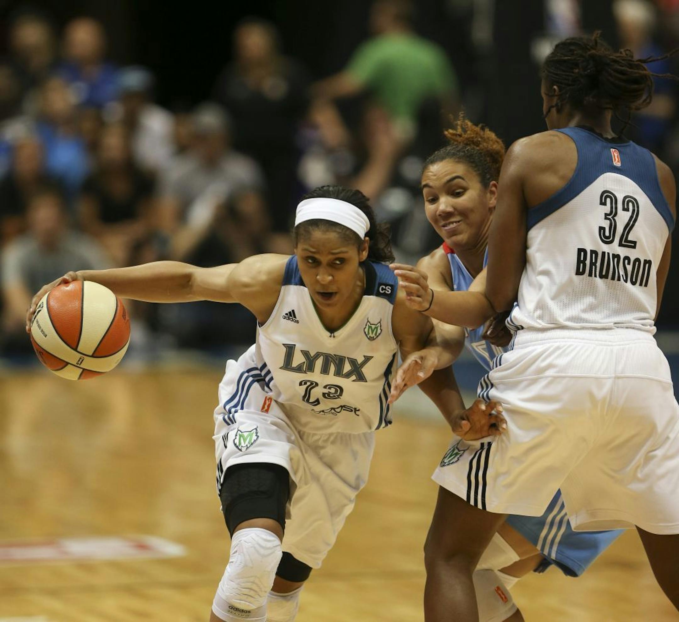 The Lynx easily defeated the Atlanta Dream 94-72 in an WNBA game Tuesday night, July 9, 2013 at Target Center. Maya Moore eluded Atlanta's Courtney Clements thanks to a pick set by teammate Rebekkah Brunson in the fourth quarter.