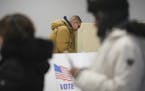 Jared Mollenkof votes at the Minneapolis Early Voting Center, Friday, Jan. 17, 2020, in Minneapolis. Mollenkof and Davis Senseman arrived the night be
