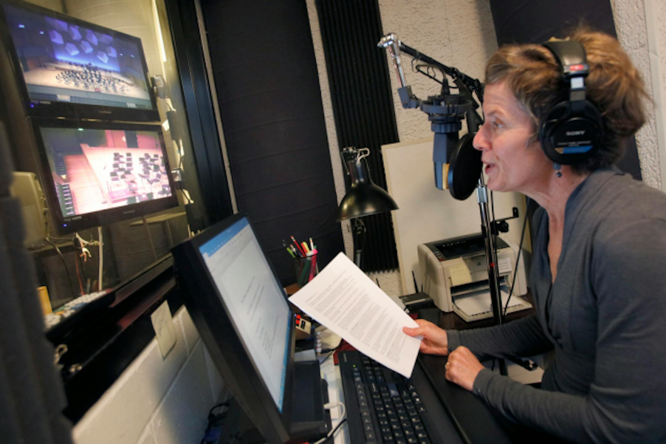 Watching the stage on video monitors in a sound booth at Orchestra Hall, Melissa Ousley prepared for a live broadcast of the Minnesota Orchestra in 2017. (Star Tribune photo by Tom Wallace)