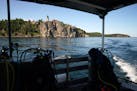 Split Rock Lighthouse is seen from the deck of a dive boat on Lake Superior. The PolyMet mine would sit in the Lake Superior watershed, meaning that p