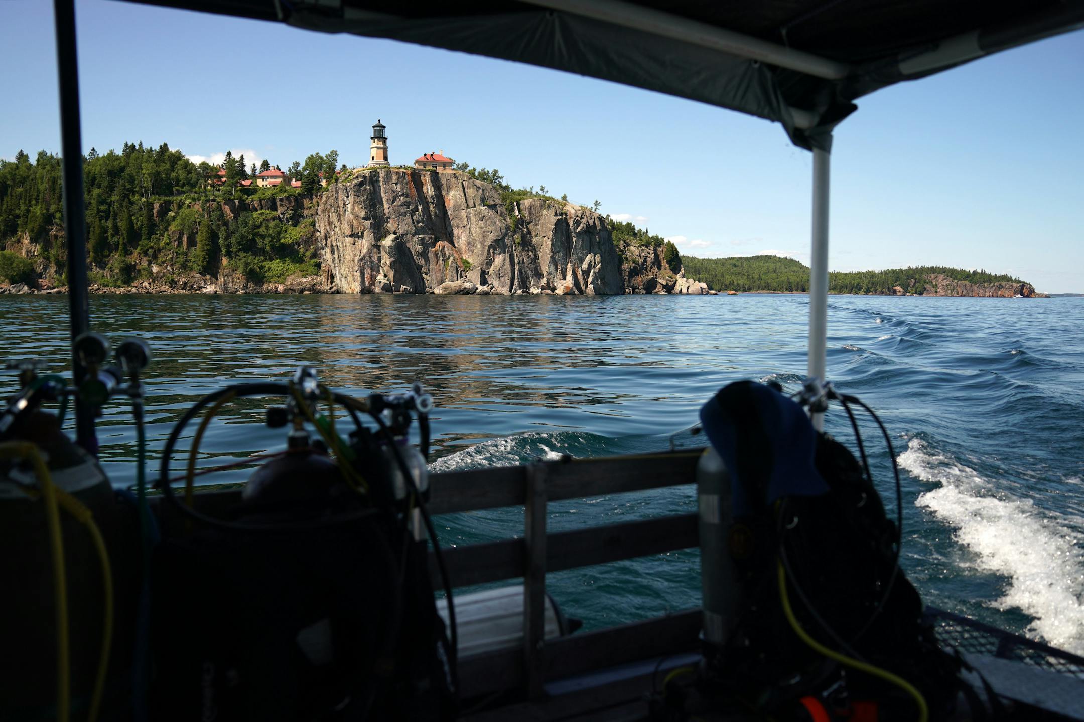 Split Rock Lighthouse is seen from the deck of a dive boat on Lake Superior. The PolyMet mine would sit in the Lake Superior watershed, meaning that pollutants could potentially drain there. Opponents of the mine have voiced concerns about how the project obtained its water-quality permit. The scuba divers of the Great Lakes Shipwreck Preservation Society dove the two most accessible shipwrecks, the Hesper, a bulk-freighter steamship that sank in Lake Superior on May 4, 1905 off Silver Bay and t