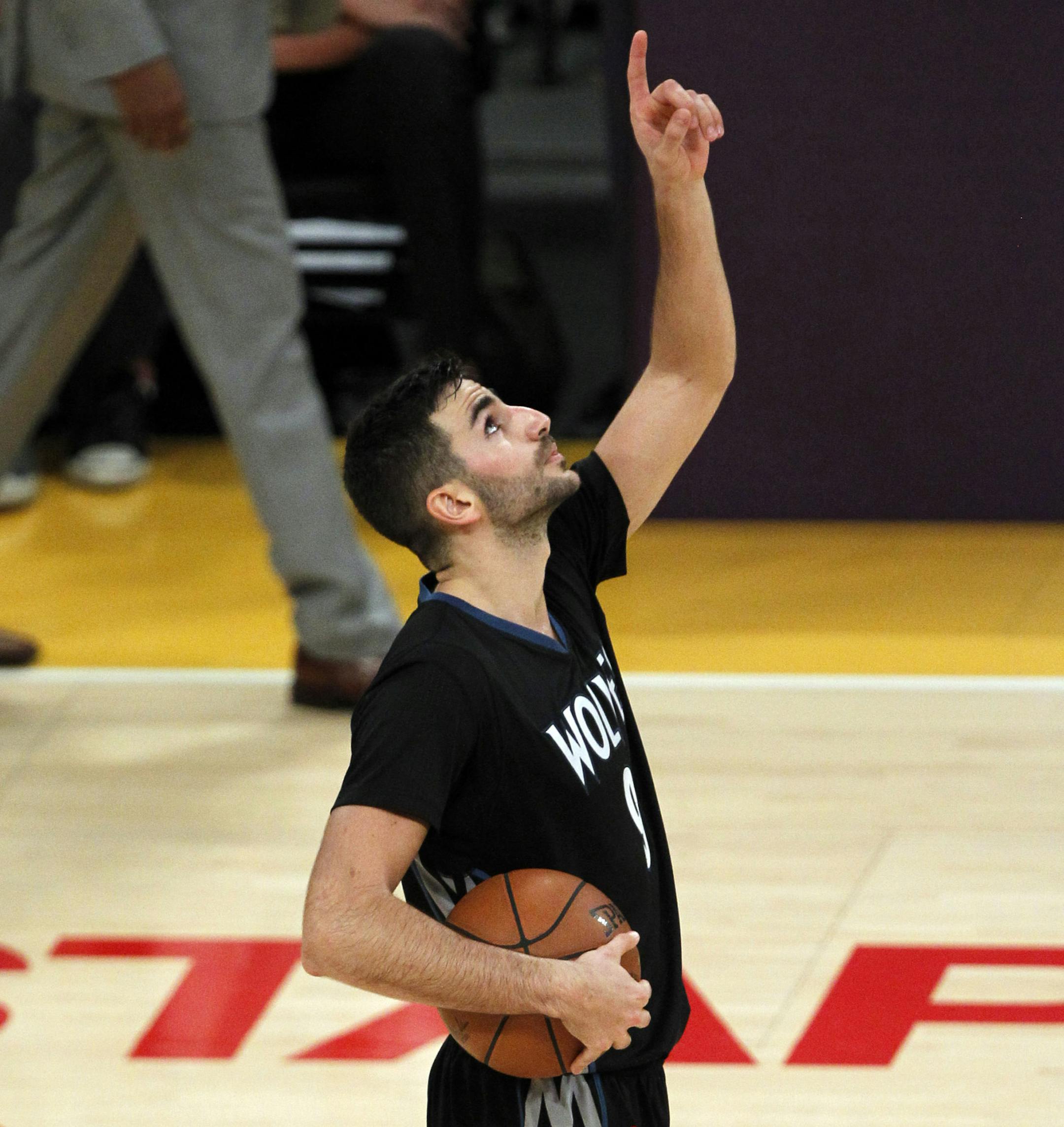 Minnesota Timberwolves guard Ricky Rubio (9), of Spain, points to the sky after defeating the Los Angeles Lakers 112-111 during an NBA basketball game in Los Angeles, Wednesday, Oct. 28, 2015. The Timberwolves won 112-111. (For the Star Tribune/Alex Gallardo) ORG XMIT: 349911 wolf102915 27