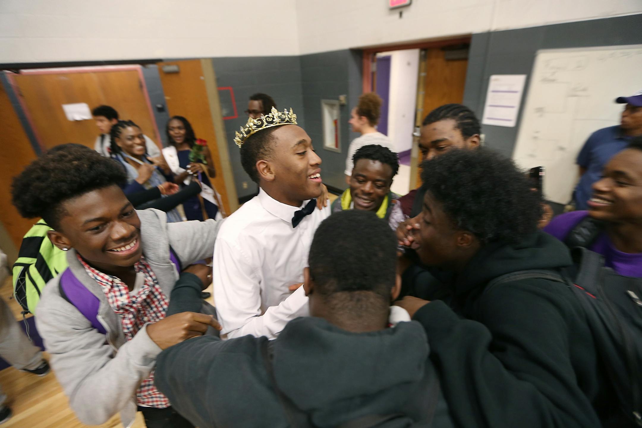 After being crowned Homecoming King Kionta Foadoaus, cq, was greeted and celebrated by his classmates at the High School, Monday, October 11, 2016 in Brooklyn Center, MN.