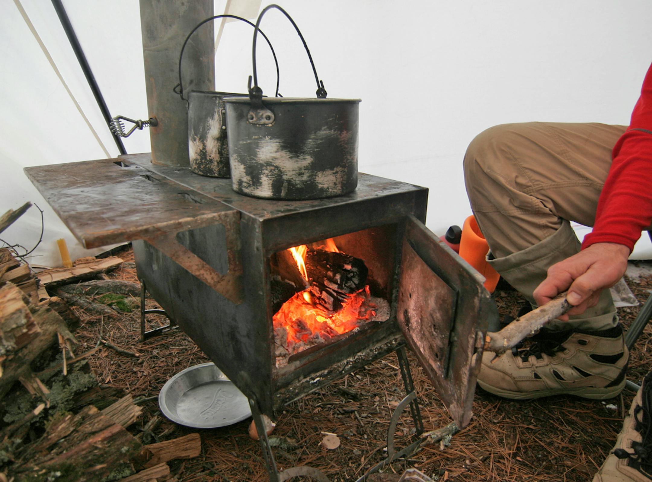 A small wood stove heated the 10-foot-by-15-foot canvass tent. The group also cooked on the stove during a three-day visit to the BWCA.Photo by Doug Smith/Star Tribune.