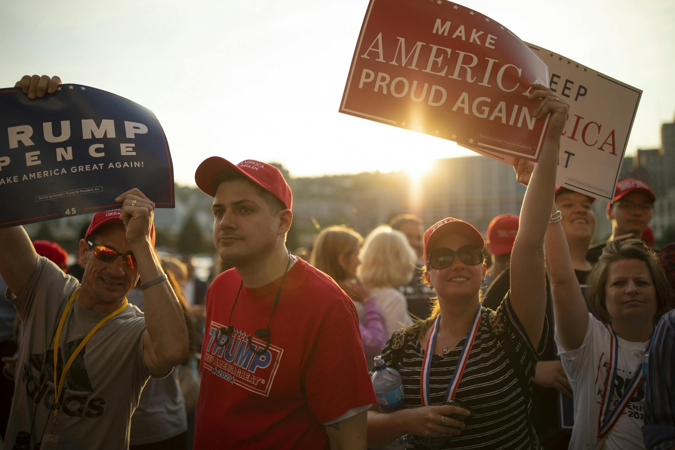 Trump supporters who attended the President's rally held signs outside Amsoil Arena afterwards.