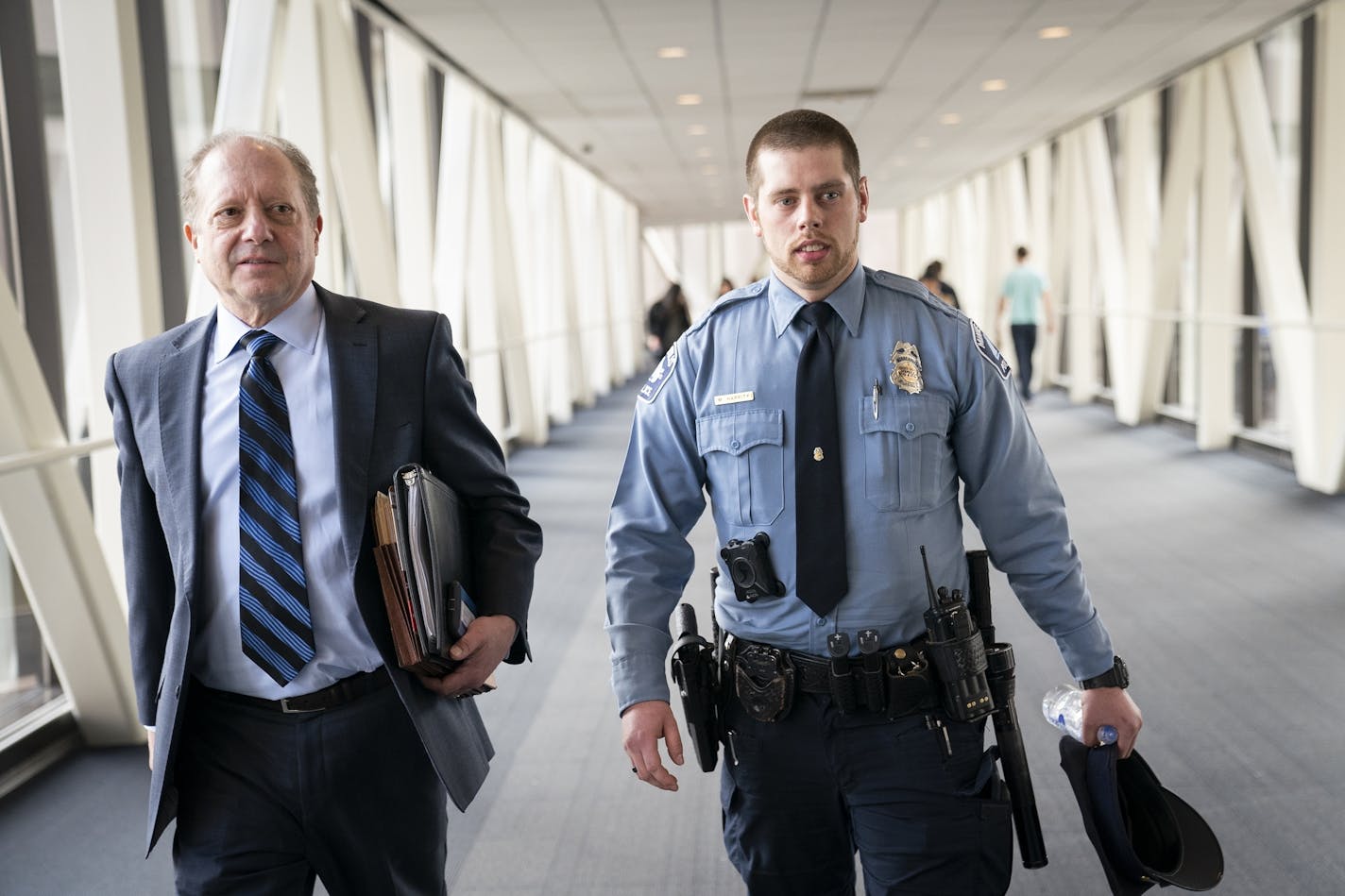 Minneapolis police officer Matthew Harrity leaves the courtroom for lunch break with his attorney Fred Bruno.