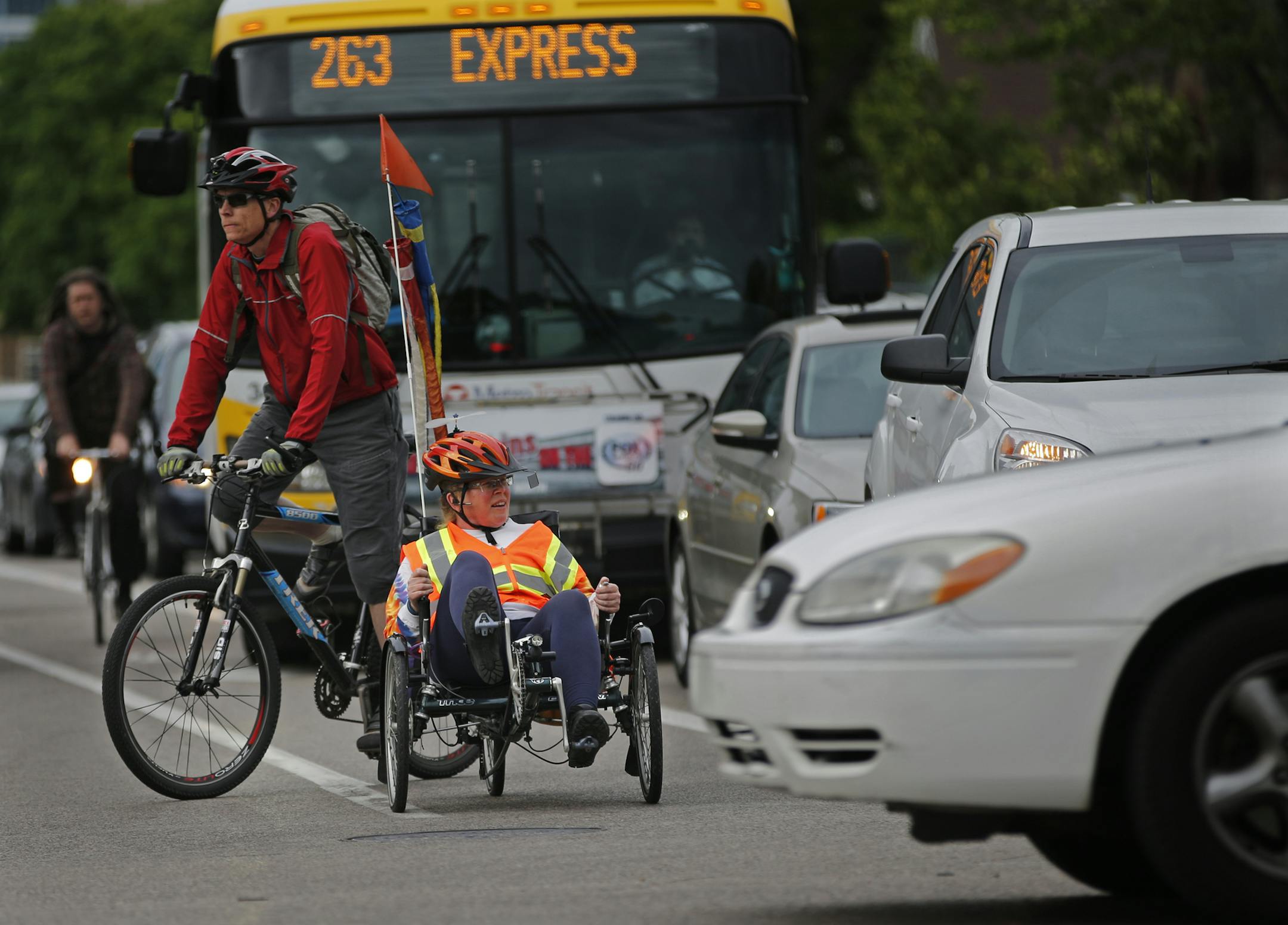Even with a bike lane, it can be nerve racking for bikers negotiate the evening rush hour traffic on Portland Ave. near the corner of Franklin.] Richard Tsong-Taatarii/rtsong-taatarii@startribune.com